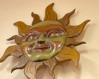 Carved large wooden sun figure