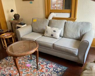 Sleeper sofa, round antique table