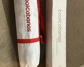 Lot 22: Cylindrical bag and rectangular box with red branding