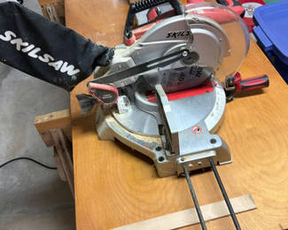 Lot 27: Two Skil brand miter saws