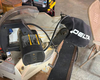 Lot 5: Delta miter saw on workbench