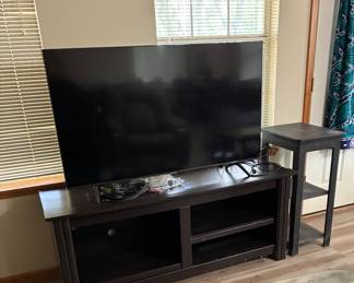 Several smart tvs and stands