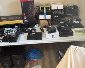 ONE OF THREE TABLES FULL OF AUDIO/COMPUTER EQUIPMENT