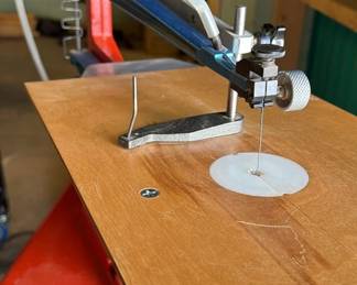 Hegner scroll saw with dust cover and saw blades