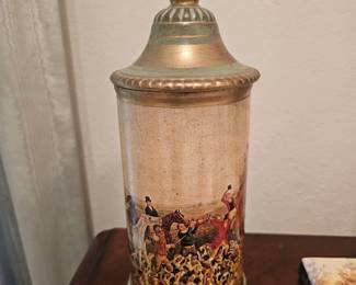 A vintage German ceramic beer stein featuring a fox hunting transfer print.