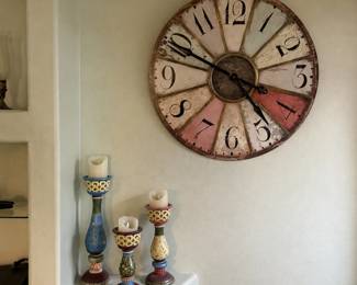 Large wall clock. Approximately 24" in diameter. Also some candleholders
