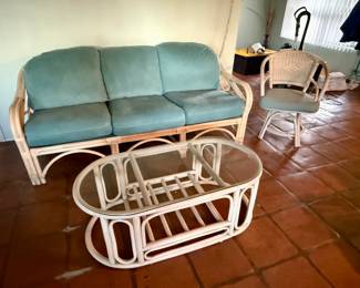 Rattan sofa and glass top coffee table