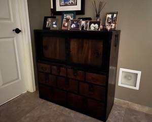 Antique Japanese Tansu chest featuring a combination of multi-drawer configurations and top sliding cabinet doors
