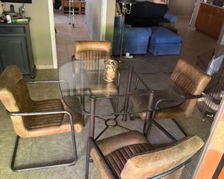 Glass top table with iron legs, 4 NEW leather chair with iron legs & arm rests