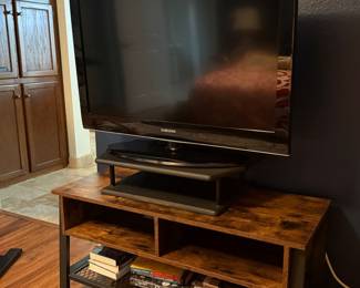 Samsung TV and rustic wood TV stand