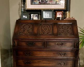 Ethan Allen drop-front secretary desk features solid wood craftsmanship, internal organizing cubby system and a distinctive green leather writing surface inlay