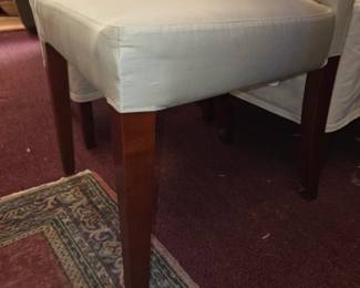 Set of 8 Pottery Barn chairs. White fabric w light green slipcovers