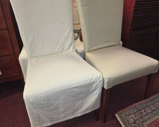 Set of 8 Pottery Barn chairs. White fabric w light green slipcovers