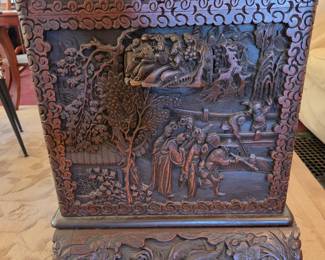 Antique, carved chest, side view