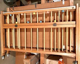 Natural Oak Folding Baby Crib with Colorful Wood Ball Accents & Casters