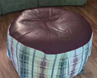 Round upholstered ottoman