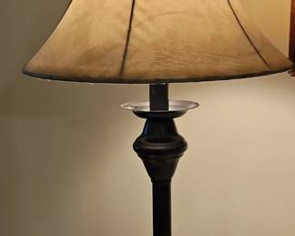 Small black metal desk lamp with parchment shade