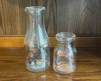 054 pairofvintagemilkbottlesandersons