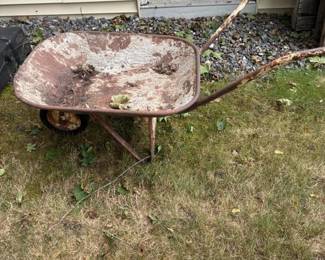 310 rusticmetalwheelbarrowwithsinglewhe