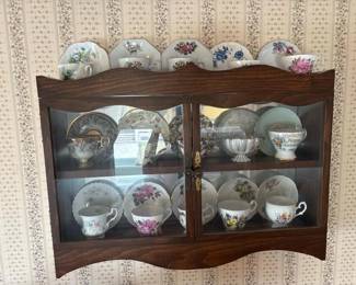 189 wallmountedcuriocabinetwithteacups