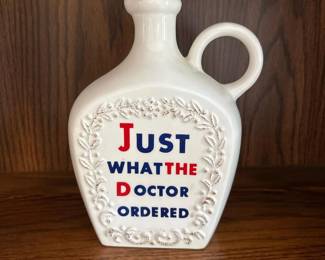 042 whiteceramicflaskwithjustwhatthed