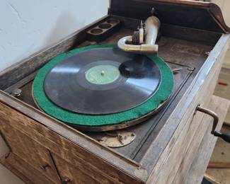 How could it work....it does even though the owner's brother left it out in the rain. Antique Turntable.