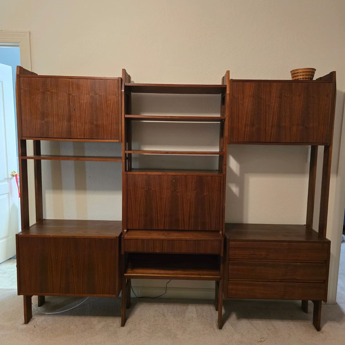 MCM Teak cabinet/shelf unit in beautiful condition. There is a key for the unit. All drawers and doors function as it should. Original price was $1200 Pricing for the weekend starts at 50% off original priced items.l