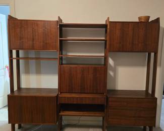MCM Teak cabinet/shelf unit in beautiful condition. There is a key for the unit. All drawers and doors function as it should. Original price was $1200 Pricing for the weekend starts at 50%  off original priced items.l