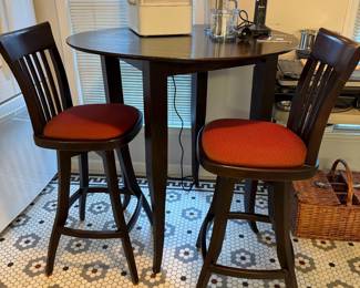 T25 - $150. Wooden Pub Table (Homemade?) with 2 Whitley Furniture Gallery Swivel Stools. Table is 41" round x 42.5" tall. Stools are 30" floor to seat. Stools are in very good condition. Table is sturdy but does have a bit of wiggle to it.