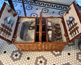 T29 - $20. Large Picnic Basket - one side has a cooler, the other has plates and dining accessories.