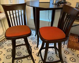 T25 - $150. Wooden Pub Table (Homemade?) with 2 Whitley Furniture Gallery Swivel Stools. Table is 41" round x 42.5" tall. Stools are 30" floor to seat. Stools are in very good condition. Table is sturdy but does have a bit of wiggle to it.