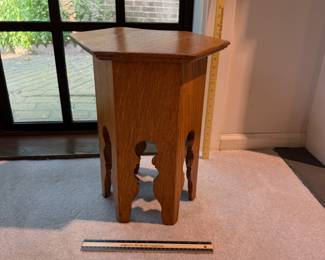 T22 - $125. Arts & Crafts Style Hexagon Wooden Side Table. Measures 13" x 15" x 17.5".