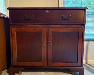 T78 - $225. Wood Bar Cabinet. Measures 36" x 18.25" x 32.75" tall. . Wooden but light and on wheels.