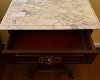 T61 - $150. Marble Top Table with Carved Lyre-Harp Pedestal. Measures 19" x 14" x 27.25" tall.