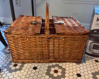 T29 - $20. Large Picnic Basket - one side has a cooler, the other has plates and dining accessories.
