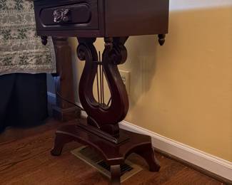 T61 - $150. Marble Top Table with Carved Lyre-Harp Pedestal. Measures 19" x 14" x 27.25" tall.
