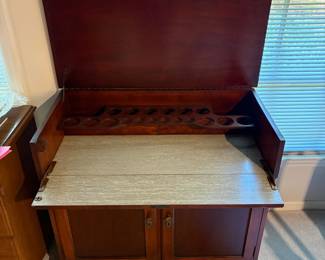 T78 - $225. Wood Bar Cabinet. Measures 36" x 18.25" x 32.75" tall. . Wooden but light and on wheels.