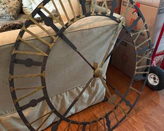Large open-face wall clock with gold Roman numerals