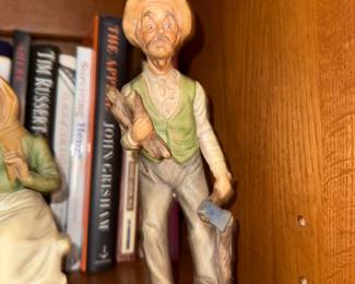 Porcelain figurine of an old man with axe and firewood