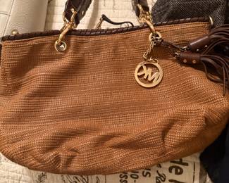 Michael Kors woven straw tote with brown leather trim and tassel