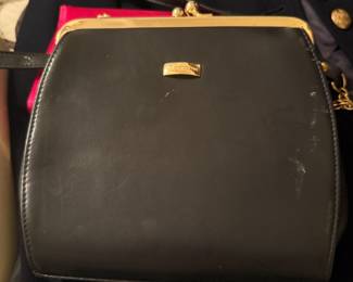 Black leather crossbody purse with gold kiss-lock frame closure