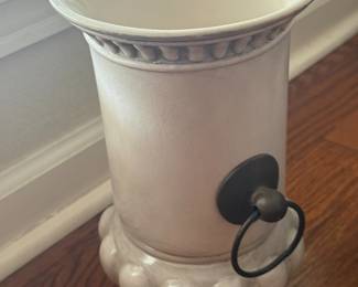 White ceramic vase with beaded base and metal ring handle