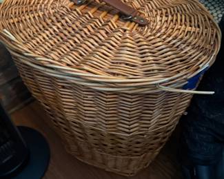 Woven wicker hamper basket with leather handle and hinged lid