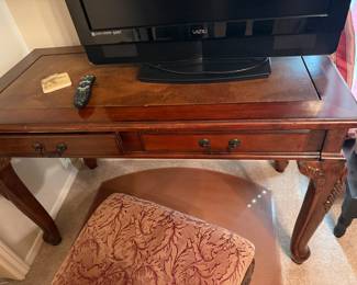 Carved wood writing desk with leather map top and two drawers
