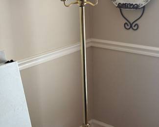 Brass floor lamp with turned column and cream shade