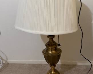Brass urn-shaped table lamp with pleated fabric shade