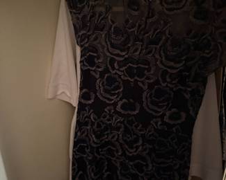 Sheer black floral embroidered dress on hanger