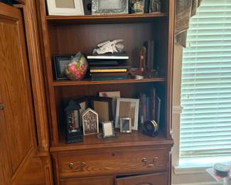 Oak bookcase hutch with cabinet base and picture frames