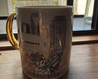 Ceramic mug with gold city skyline and Mardi Gras design