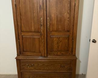 Oak armoire with two doors and two base drawers